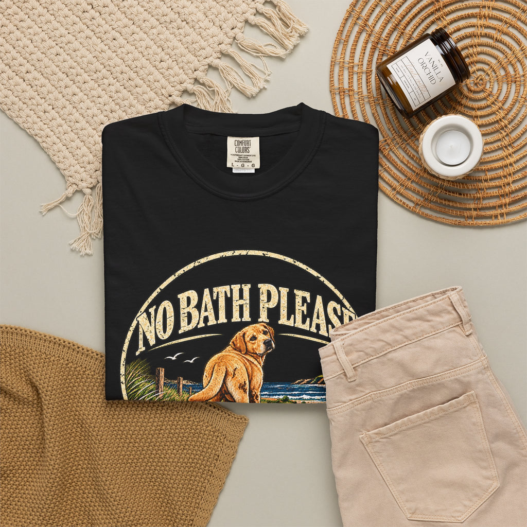 Flat-lay Brinehound T-shirt mockup showing dog in a No Bath Please coastal badge.