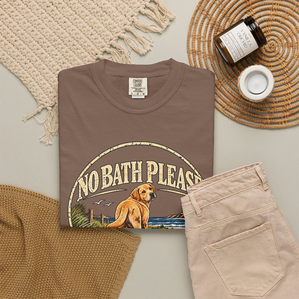 Flat-lay Brinehound T-shirt mockup showing dog in a No Bath Please coastal badge.