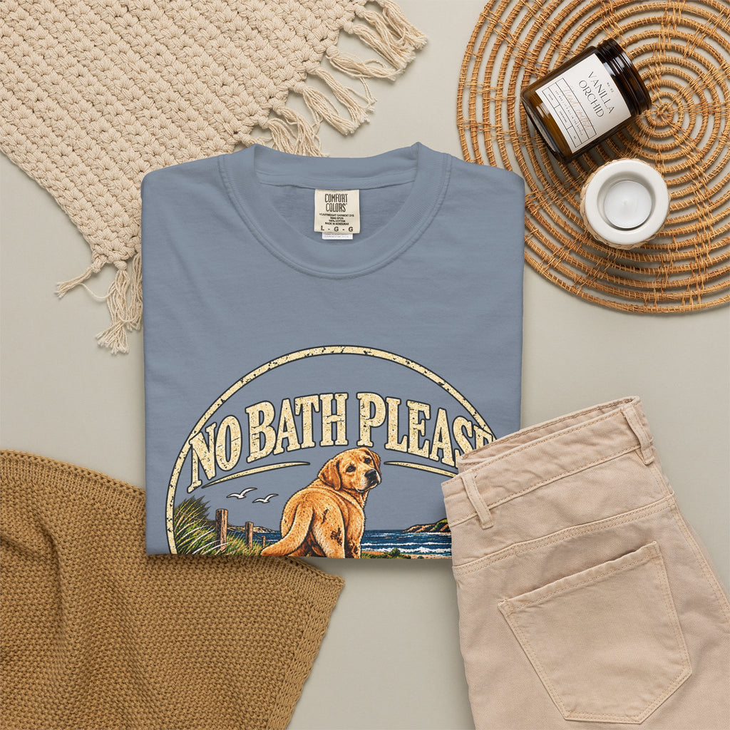 Flat-lay Brinehound T-shirt mockup showing dog in a No Bath Please coastal badge.