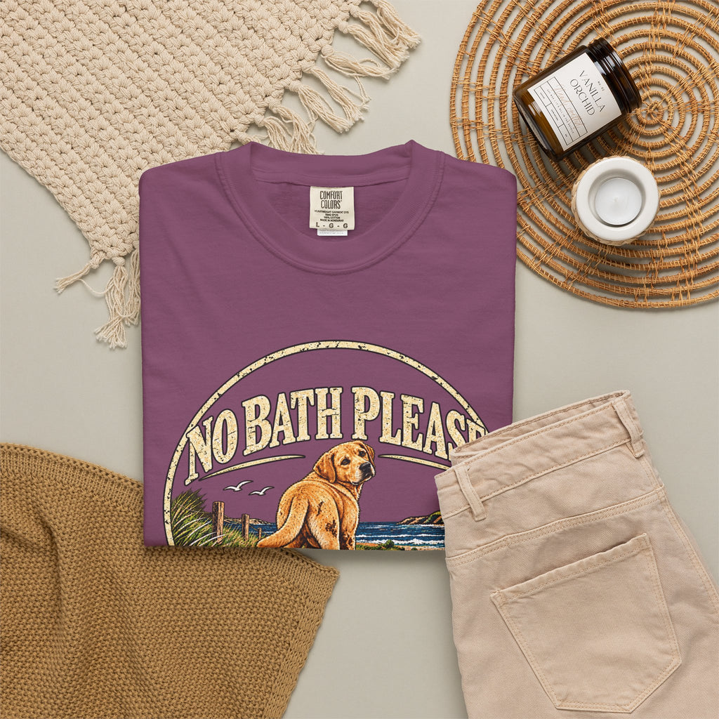 Flat-lay Brinehound T-shirt mockup showing dog in a No Bath Please coastal badge.