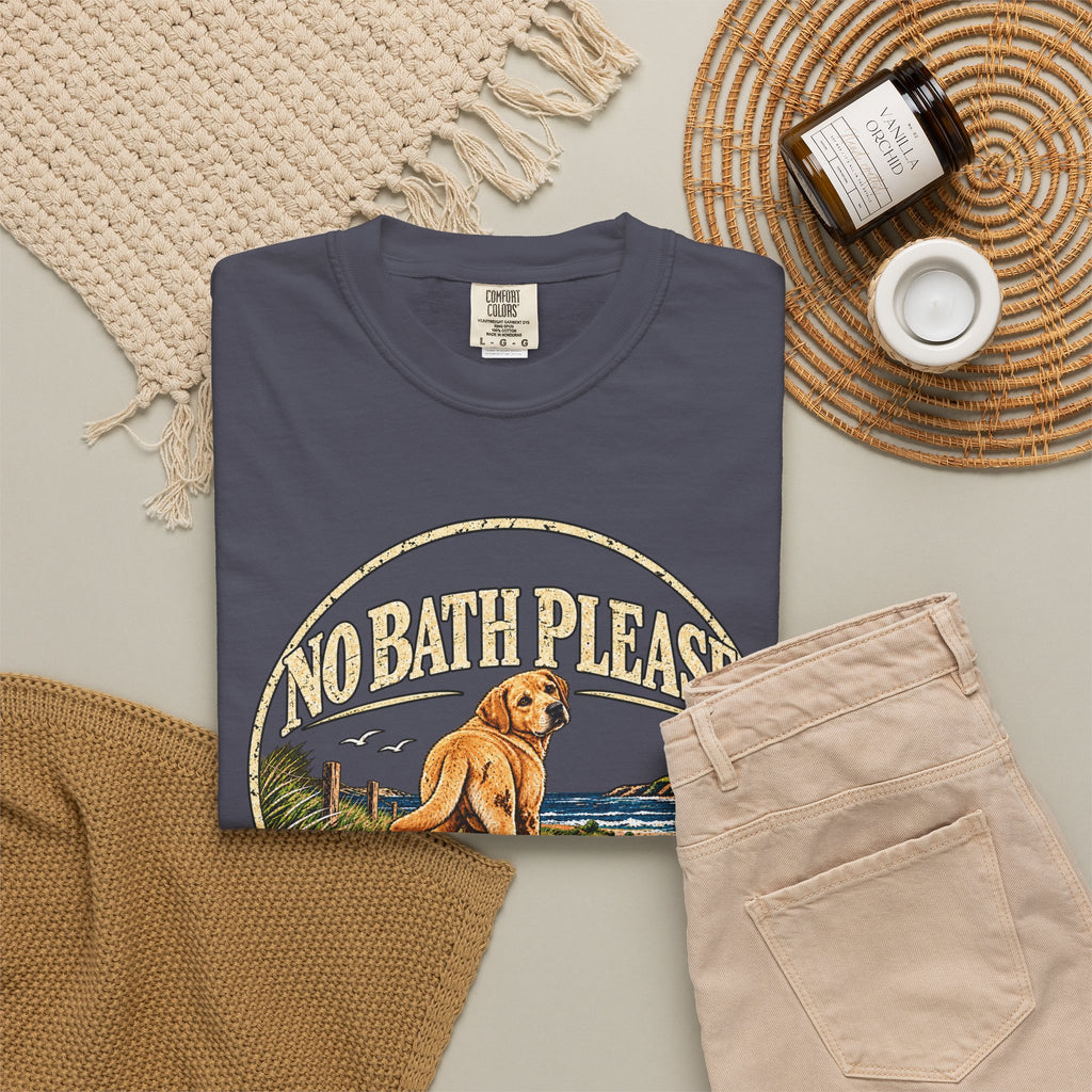 Flat-lay Brinehound T-shirt mockup showing dog in a No Bath Please coastal badge.