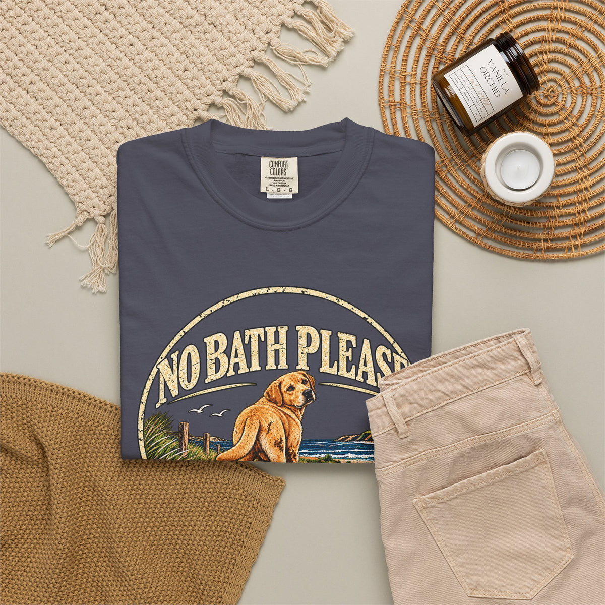 Flat-lay Brinehound T-shirt mockup showing dog in a No Bath Please coastal badge.