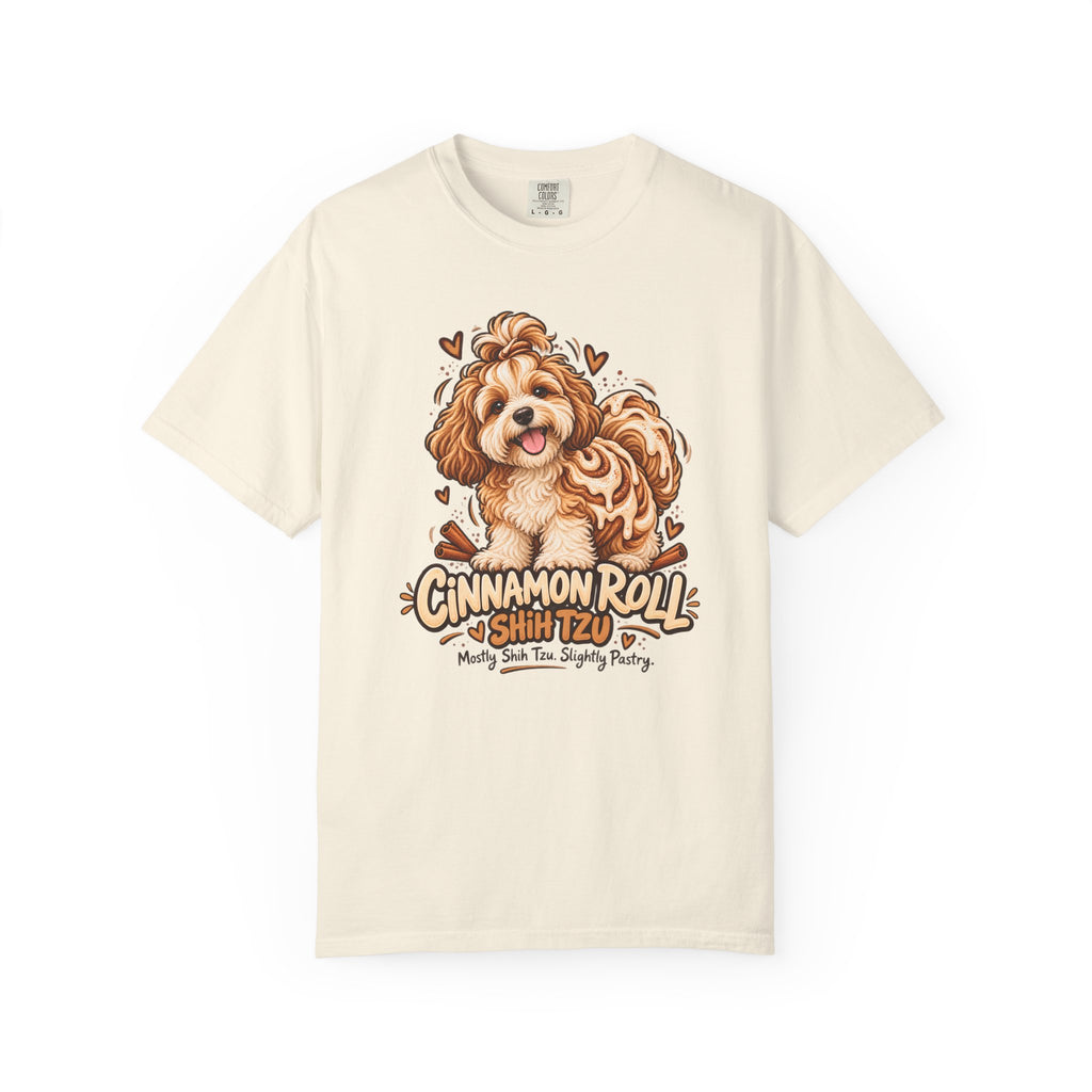 Ivory Cinnamon Roll Shih Tzu T-shirt, featuring a shaggy Shih Tzu combined with a cinnamon pastry swirl and the wording “Cinnamon Roll Shih Tzu — Mostly Shih Tzu. Slightly Pastry.”