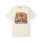 Ivory Loaf Dog T-shirt, featuring a sleeping dog shaped like a golden loaf of bread and the wording “Loaf Dog — Dog or loaf of bread? You decide.”