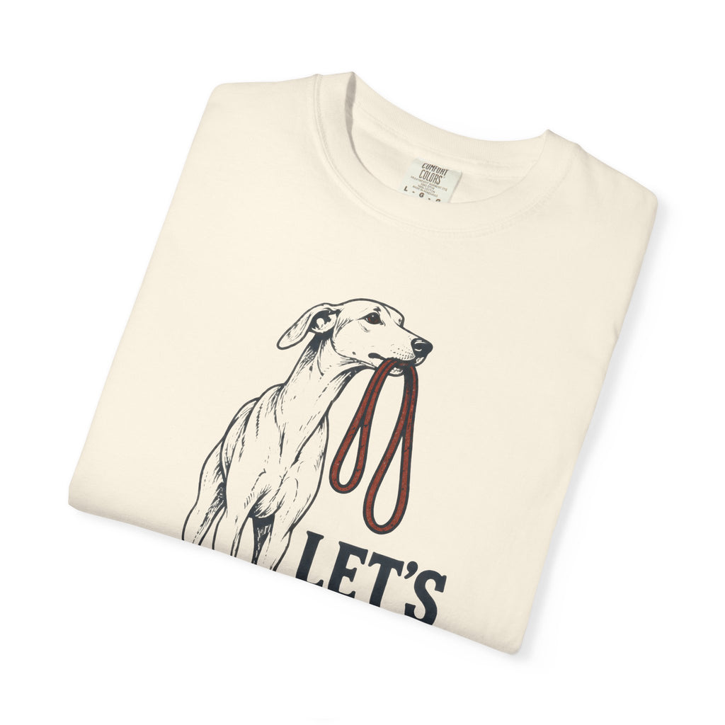 Folded Brinehound T-shirt showing a long-legged dog beneath Let’s Go lettering.