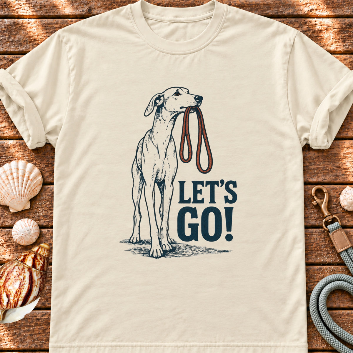 Front view of a Brinehound T-shirt showing a long-legged dog beneath Let’s Go lettering.