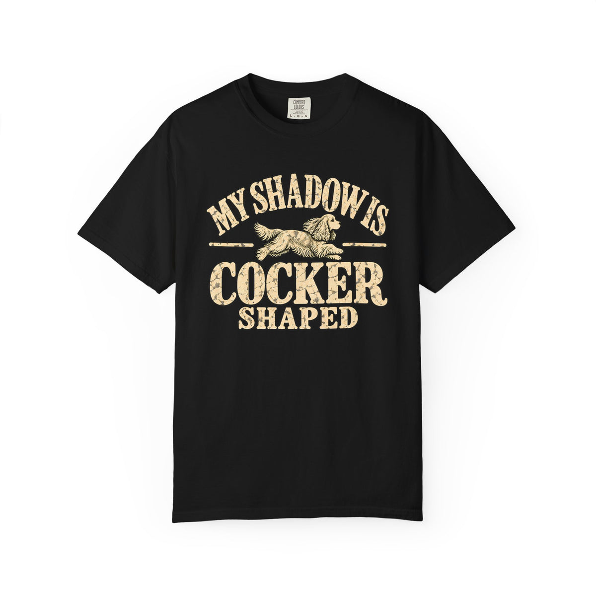 Front of a dark T-shirt with the Cocker Spaniel illustration and “My shadow is cocker shaped” lettering.