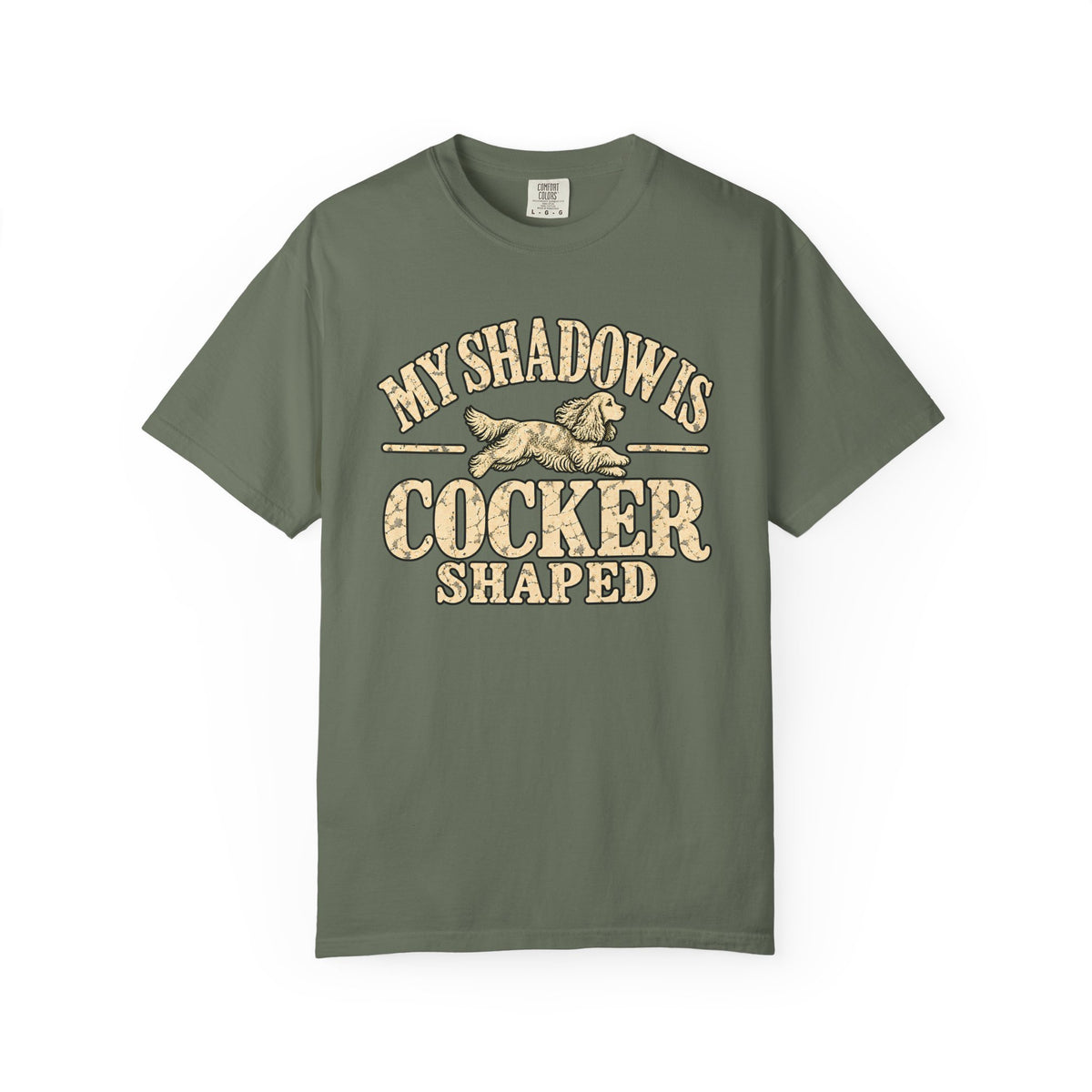 Front of a Moss T-shirt with the Cocker Spaniel illustration and “My shadow is cocker shaped” lettering.