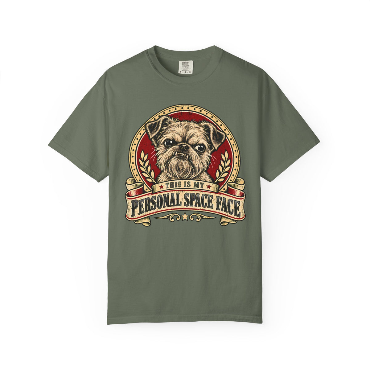 Front of a Moss T-shirt with a vintage red-and-cream Bruxelles Griffon “This is my personal space face” badge.