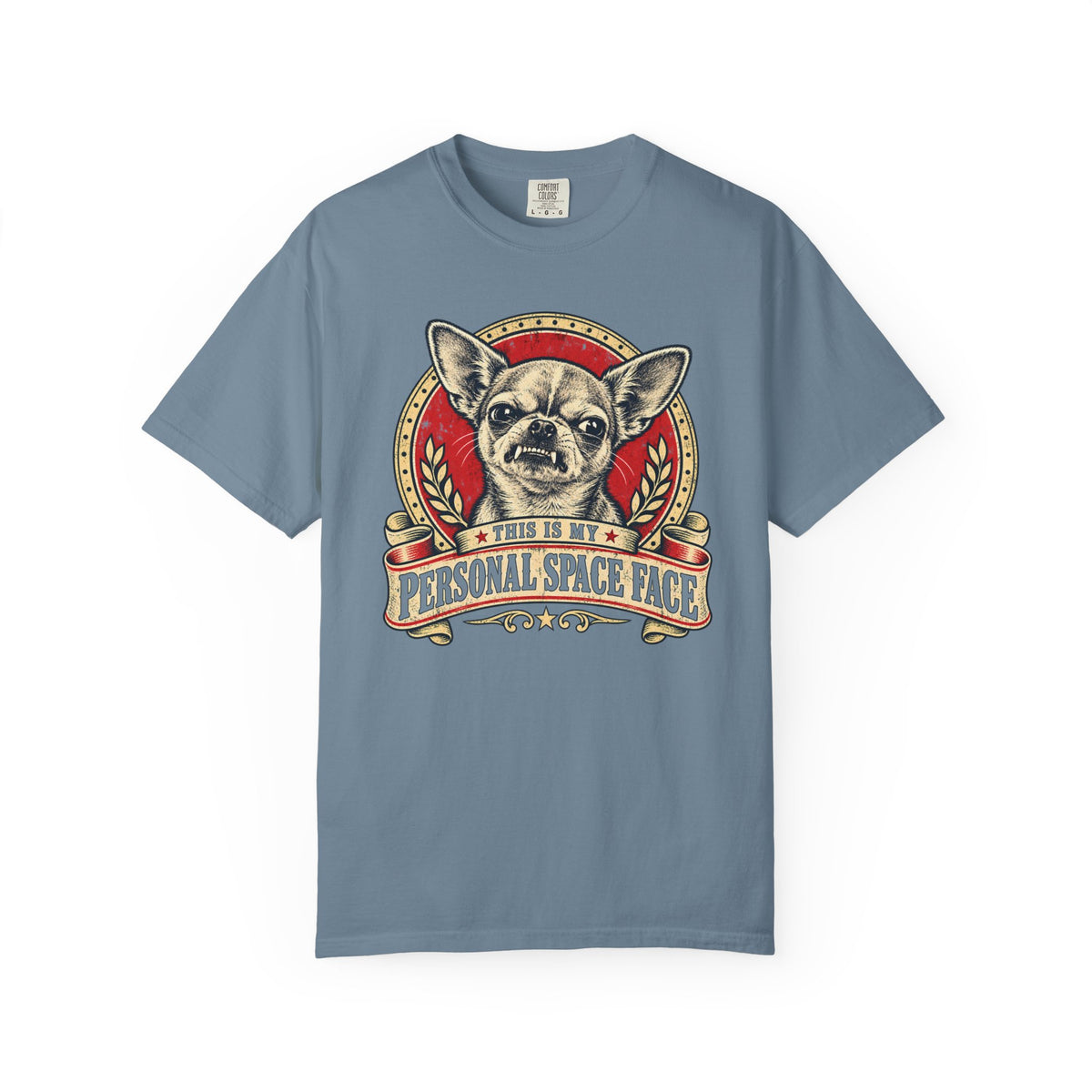 Front of a Ice Blue T-shirt with a vintage red-and-cream Chihuahua “This is my personal space face” badge.
