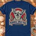 True Navy T-shirt with the Chihuahua “This is my personal space face” badge, laid on wood beside seashells and a dog lead.
