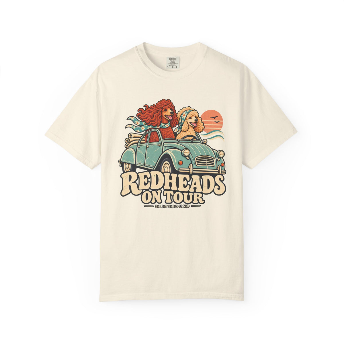 Front of a Ivory T-shirt featuring two poodles in a teal car and “Redheads on Tour” lettering.