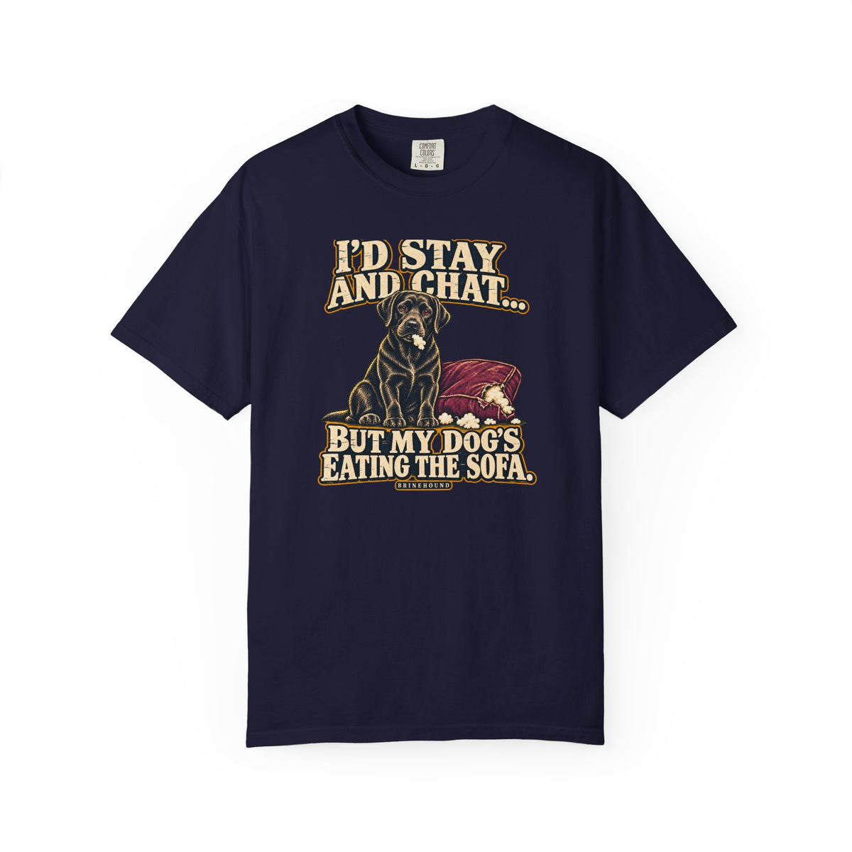 Front of a True Navy T-shirt with a vintage black Labrador beside a chewed sofa and “I’d stay and chat” lettering print.