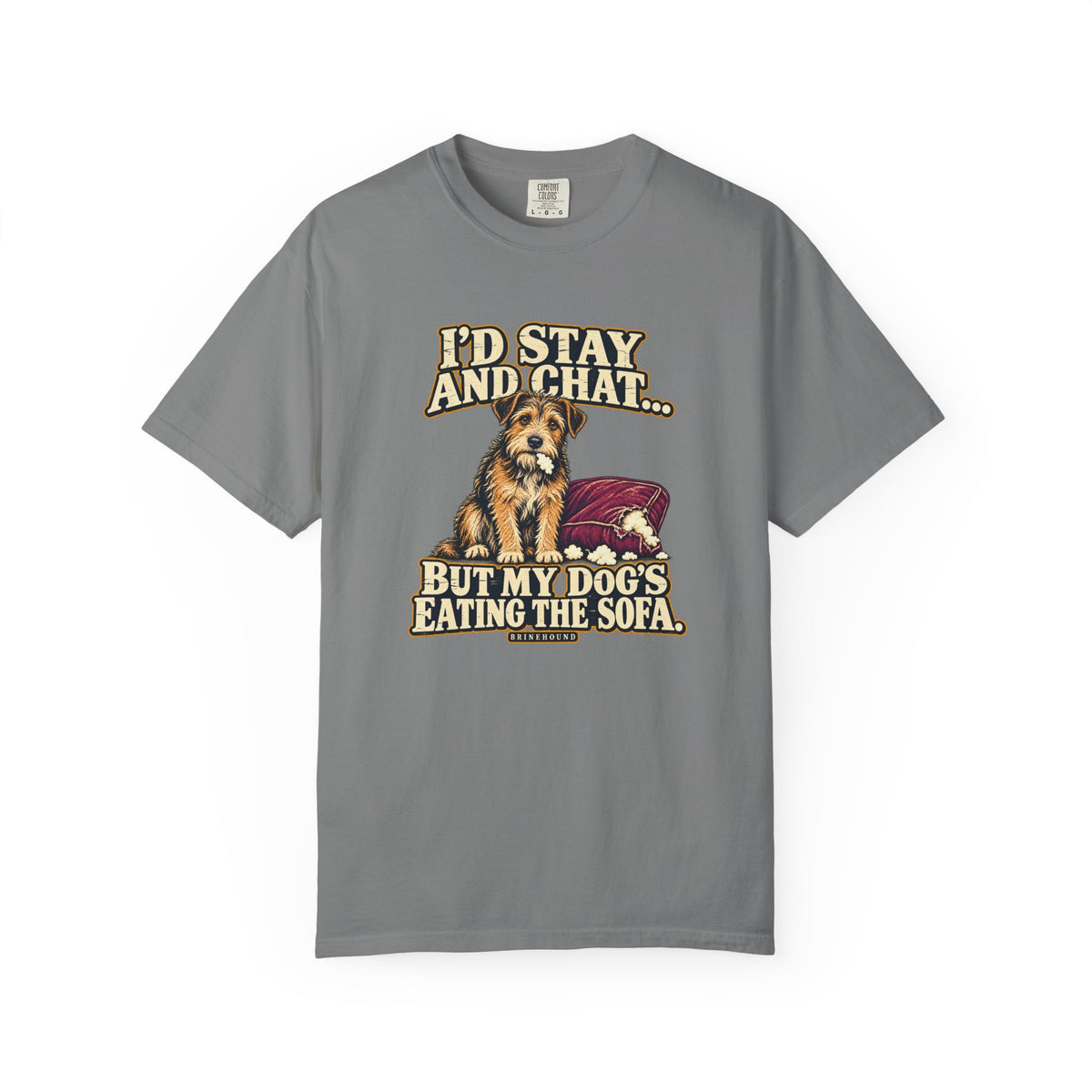 Front of a Grey T-shirt with a vintage scruffy terrier beside a chewed sofa and “I’d stay and chat” lettering print.