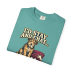 Folded Seafoam T-shirt showing a close-up of the scruffy terrier beside a chewed sofa and “I’d stay and chat” lettering print.