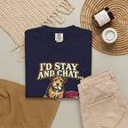 True Navy T-shirt with the scruffy terrier beside a chewed sofa and “I’d stay and chat” lettering print, styled with beige trousers and coffee.